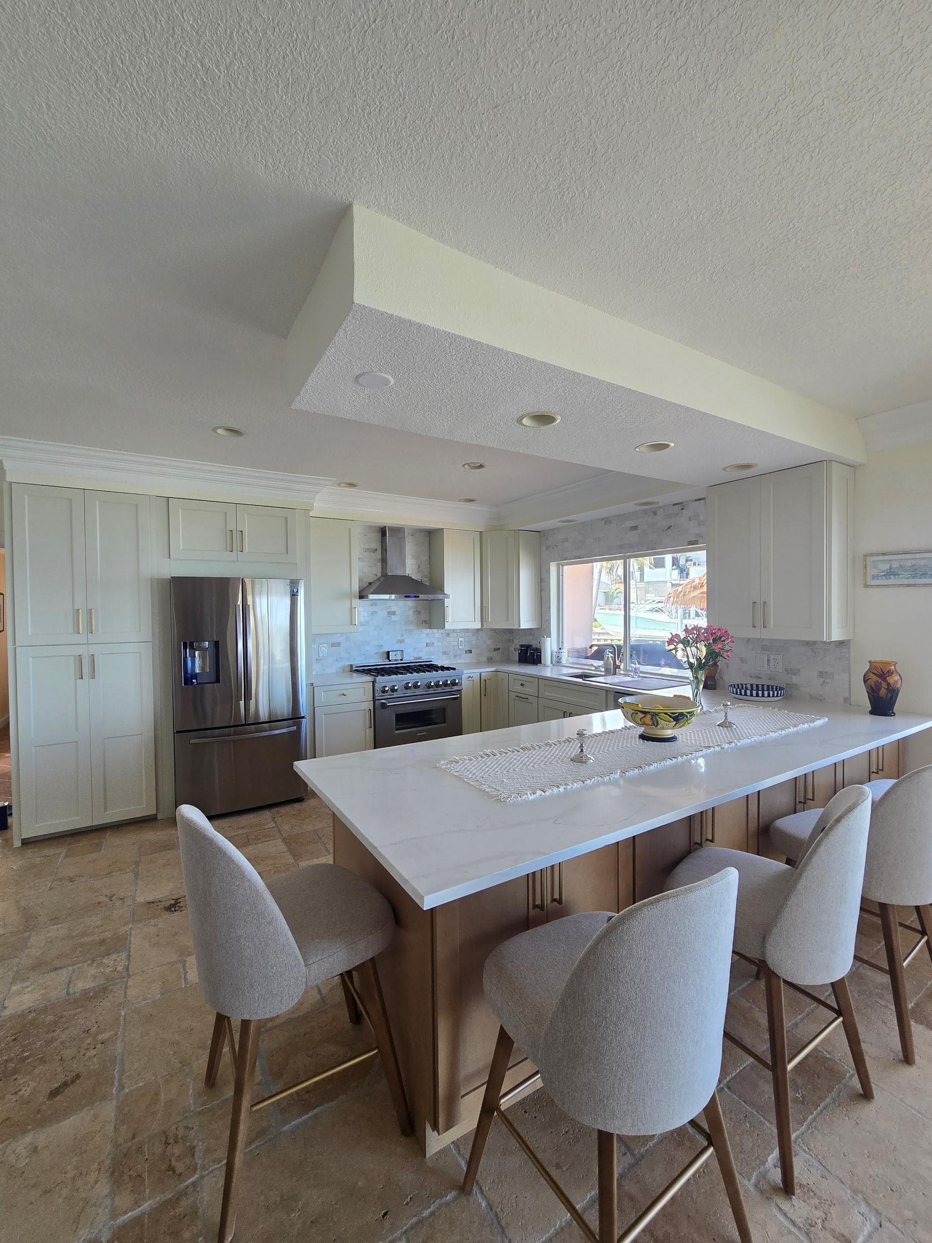 Kitchen remodeling in Valrico FL with custom cabinets, quartz or granite countertops, backsplash, modern lighting, open concept design and new flooring