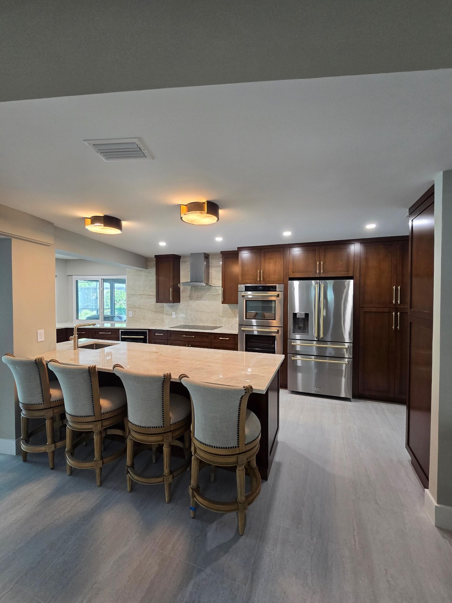 Kitchen remodeling in Palm Harbor FL with custom cabinets, quartz or granite countertops, backsplash, modern lighting, open concept design and new flooring