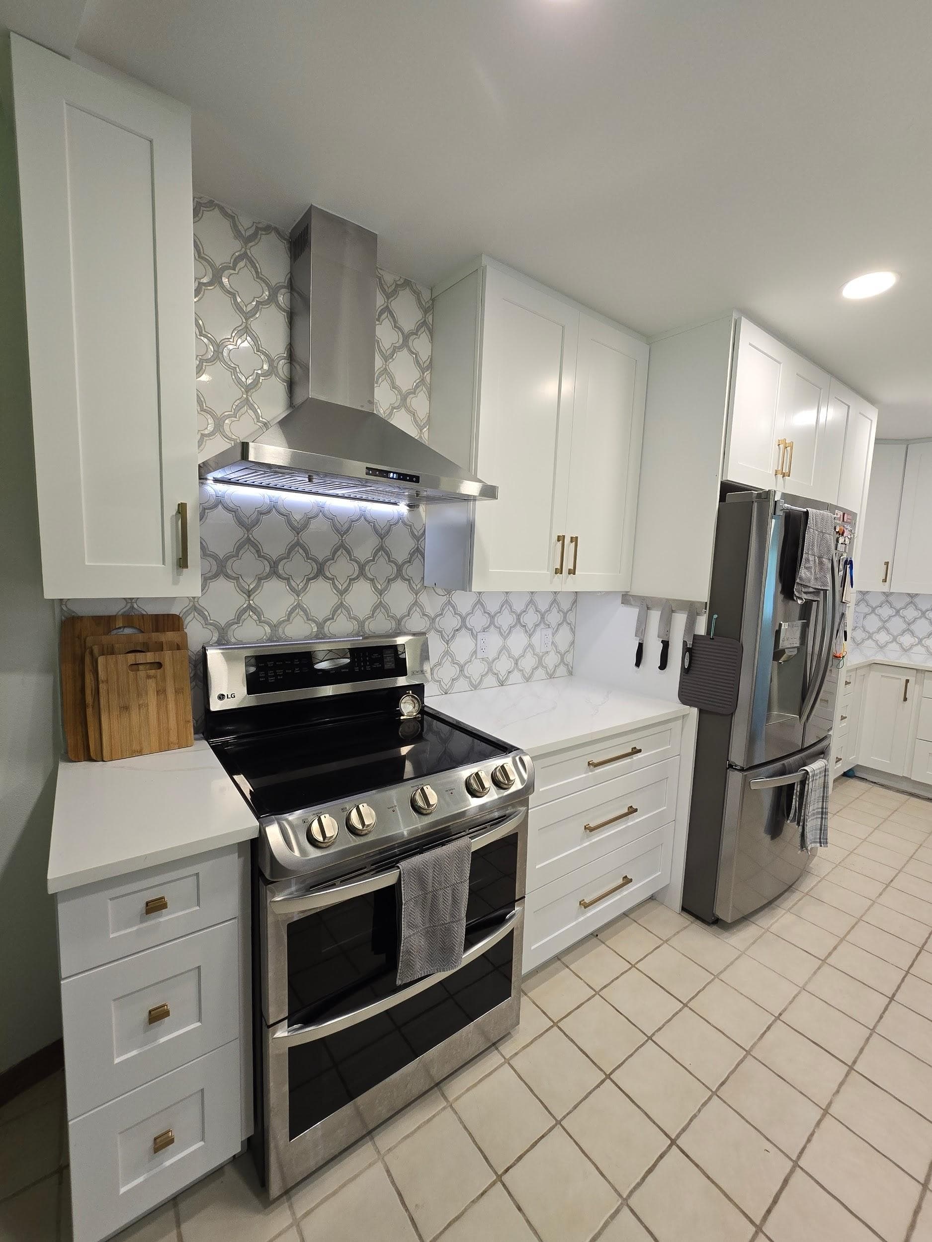 Kitchen remodeling in Westchase FL with custom cabinets, quartz or granite countertops, backsplash, modern lighting, open concept design and new flooring