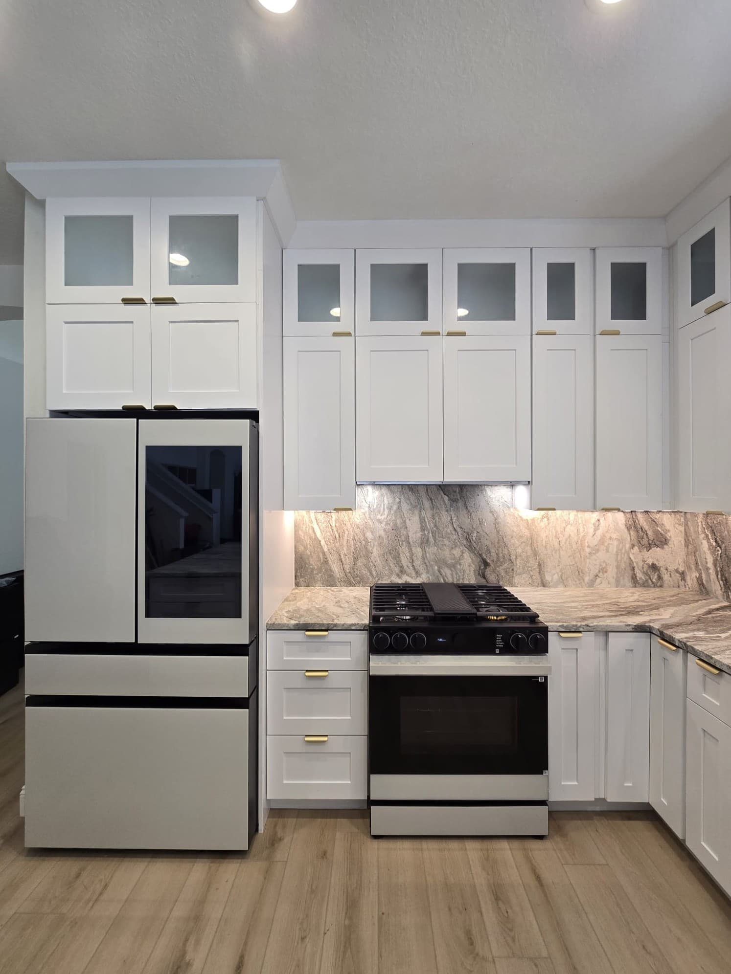 Kitchen remodeling in Hillsborough County FL with custom cabinets, quartz or granite countertops, backsplash, modern lighting, open concept design and new flooring